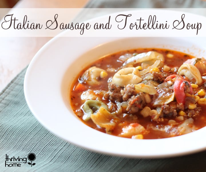 Italian Sausage and Tortellini Soup. Comfort food that is bursting with flavor. This recipe is really filling to so it is great for large families for for large groups. Such a delicious, healthy soup recipe that is freezer friendly! | Thriving Home