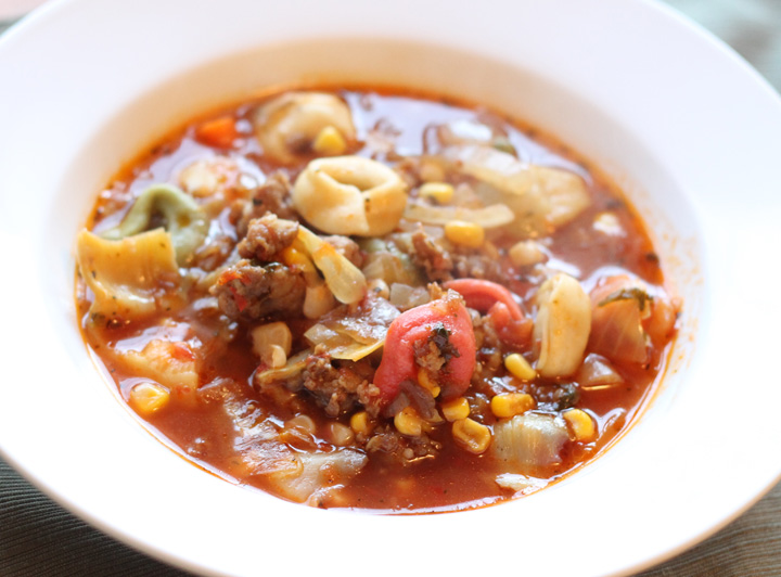 Italian Sausage and Tortellini Soup. Comfort food that is bursting with flavor. This recipe is really filling to so it is great for large families for for large groups. Such a delicious, healthy soup recipe that is freezer friendly! | Thriving Home