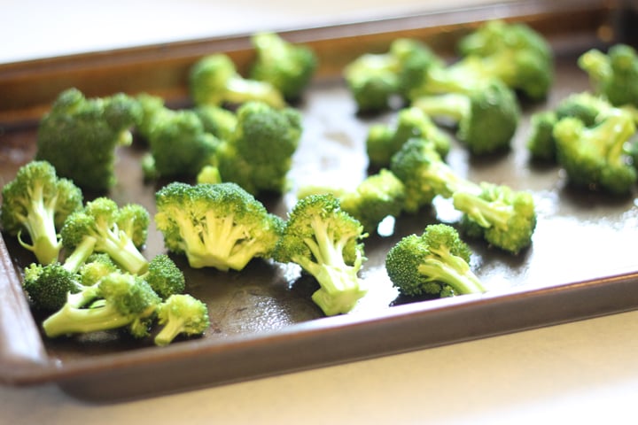 Raw broccoli on a baking sheet