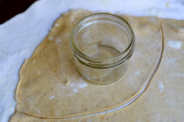 dough being measured for pie in a jar
