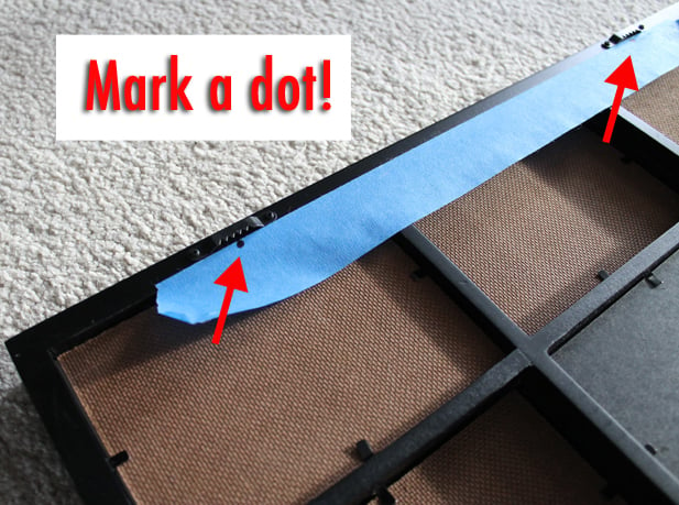 Hack to hanging a picture straight. Use painters tape to mark the brackets. 