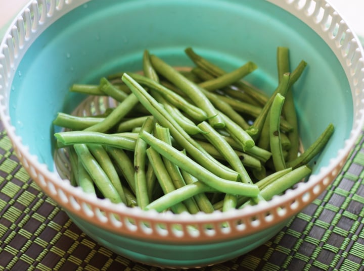 Fresh green beans in a strainer