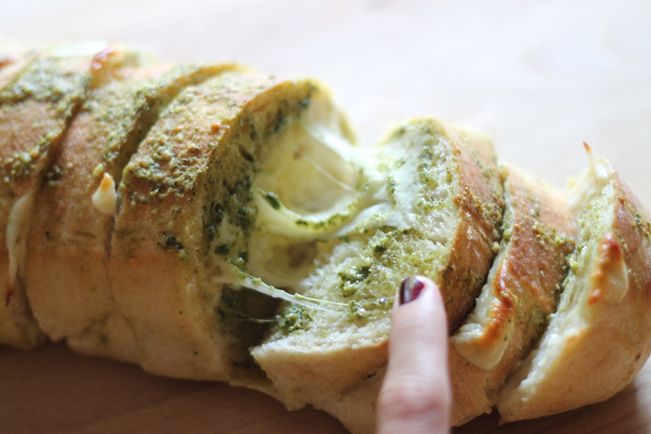 Pesto cheese bread. A delicious twist on the average garlic bread that you may throw in the oven. My husband can't get enough of this stuff!