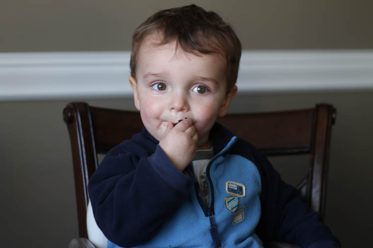 Boy eating chocolate zucchini bread