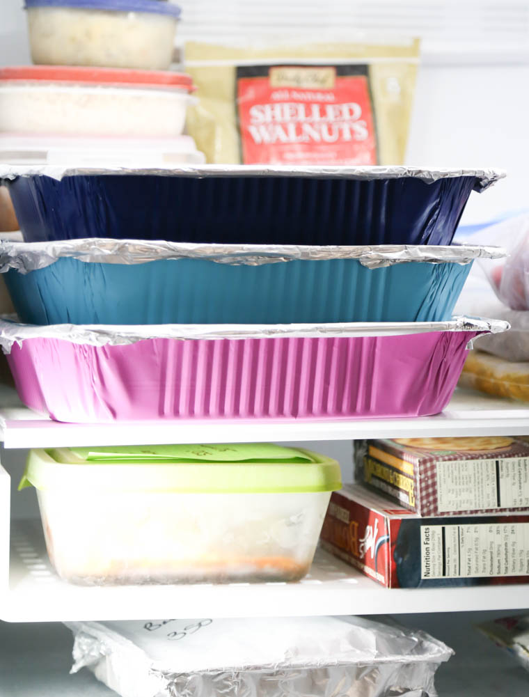 Colorful freezer containers in a freezer