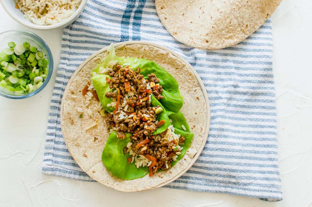 asian chicken filling inside a tortilla