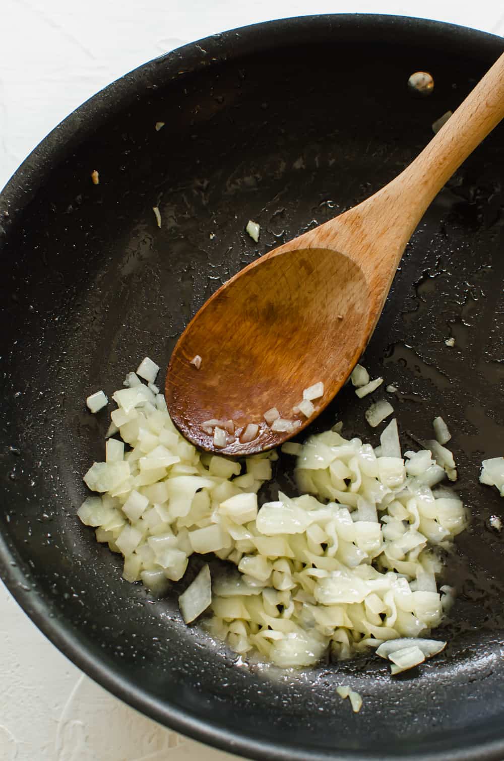 diced onions beting sauted in a pan