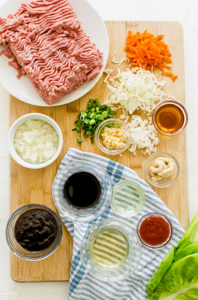 overhead shot of ingredients for asian lettuce wraps in individual bowls 