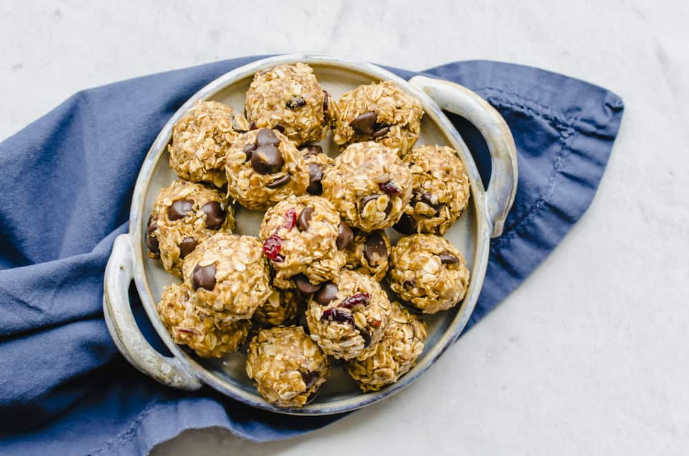 Powerball cookies stacked on a gray serving platter.