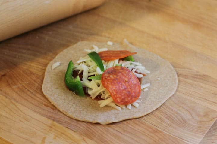 Homemade pizza pockets are a kid and adult favorite! They're packed with the yumminess of pizza without any added ingredients or fillers.