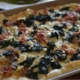 kale, yukon golds, and bacon pizza