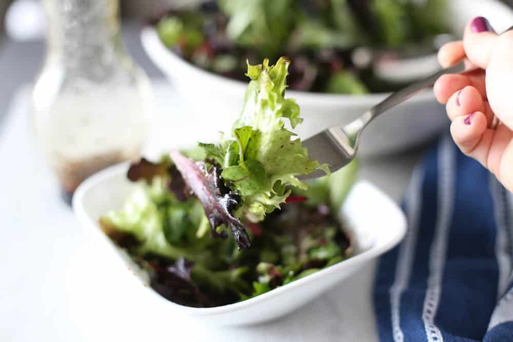 Wilted Lettuce Salad in a bowl with a fork