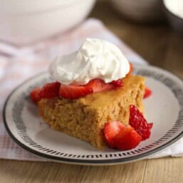 A slice of healthier whole wheat Strawberry Shortcake on a plate.