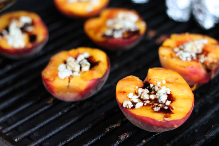 Grilled Peaches on a grill with Gorgonzola cheese.