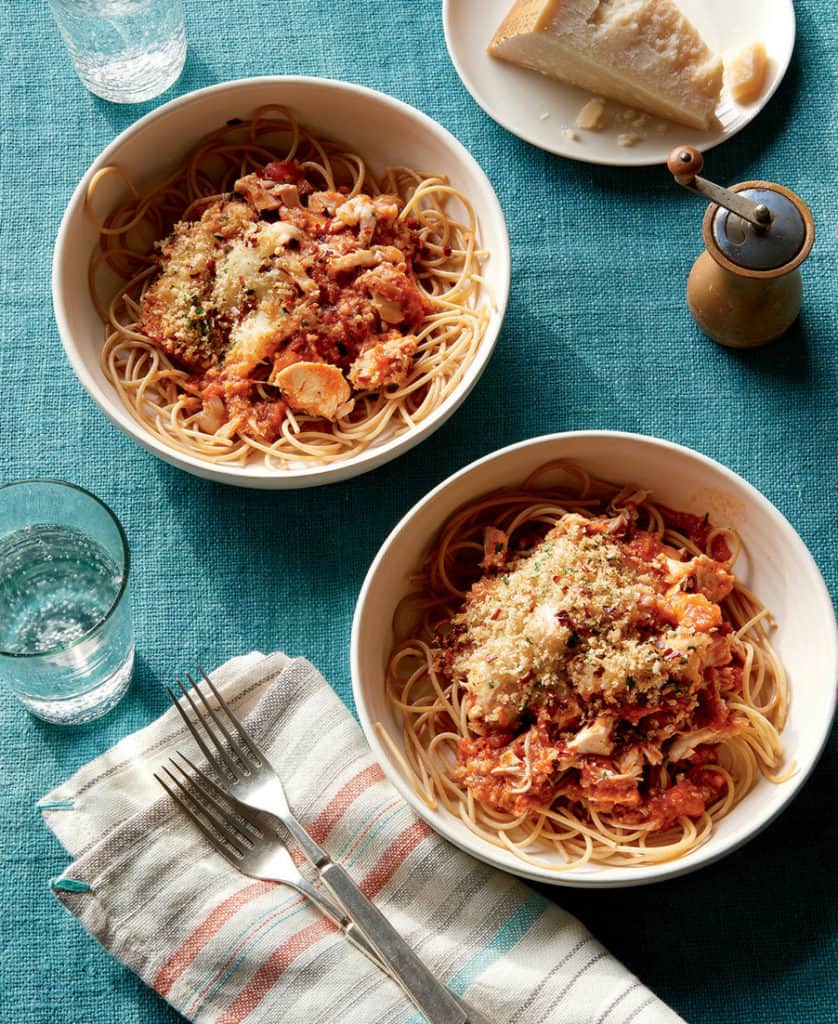 Chicken parmesan casserole in white bowls