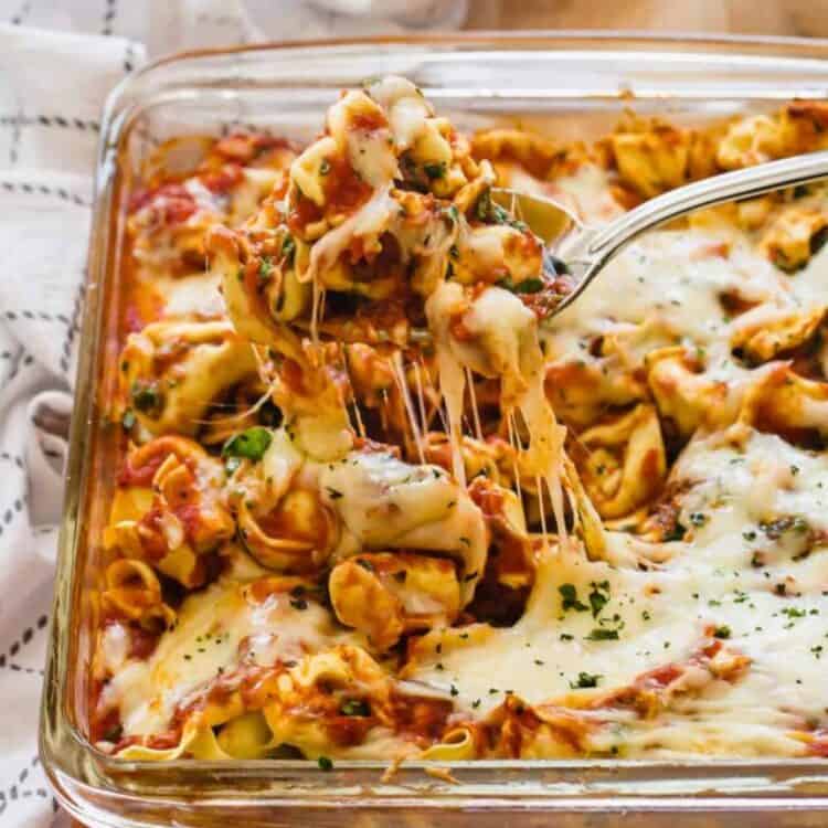 Baked cheese tortellini in glass dish.