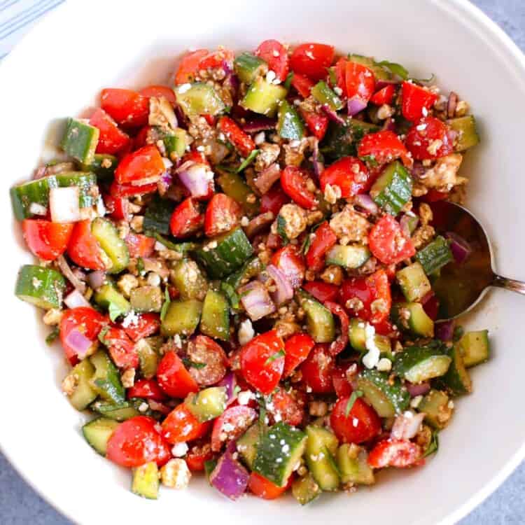 Cucumber Tomato Feta Salad in a white bowl.