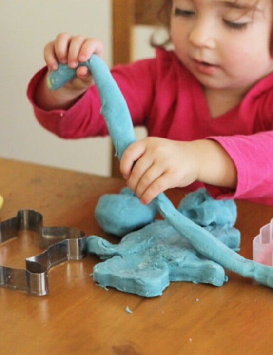 A child playing with playdough.