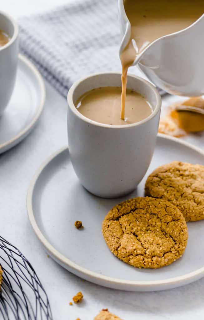 pumpkin spice latte being poured into a mug