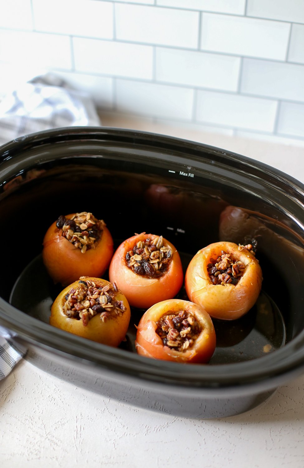 Fully cooked Baked Apples in a crockpot.