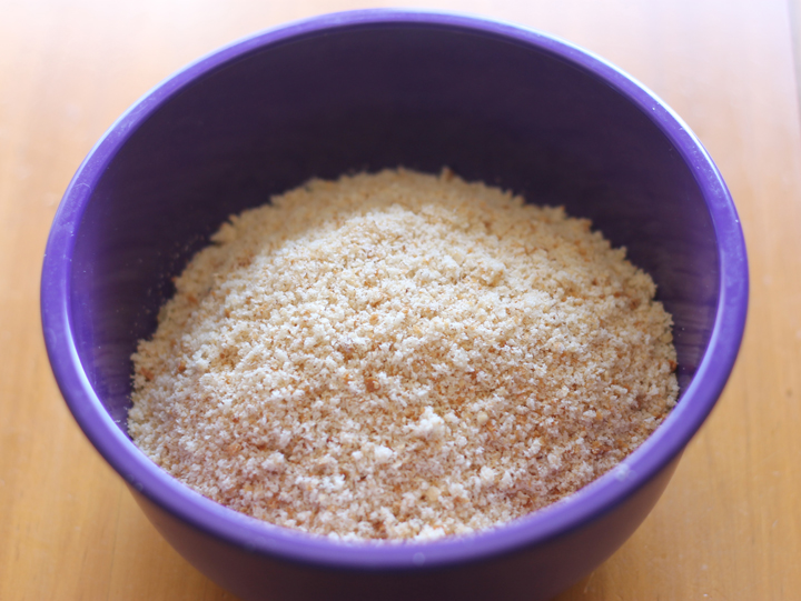 Homemade bread crumbs in a blue bowl.