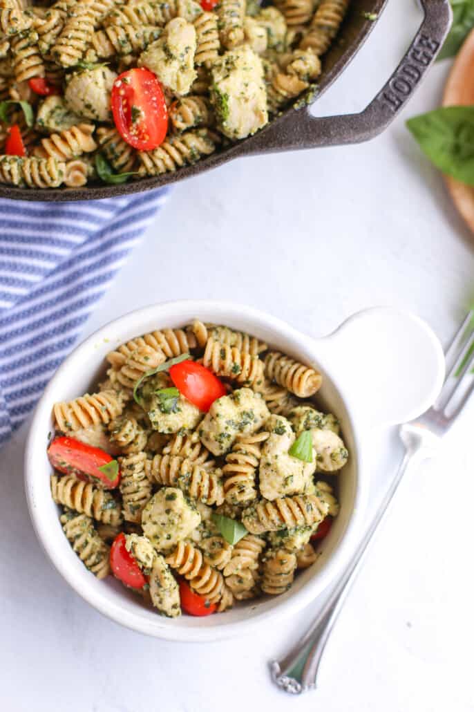 overhead of pesto chicken pasta in a bowl