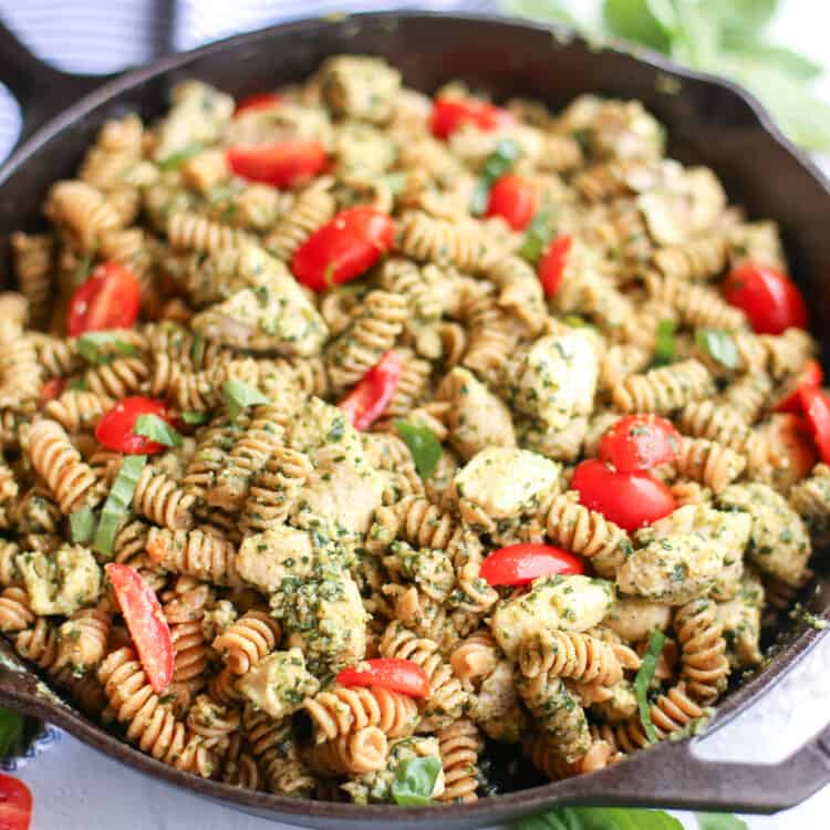 horizontal shot of finished chicken pesto pasta in skillet