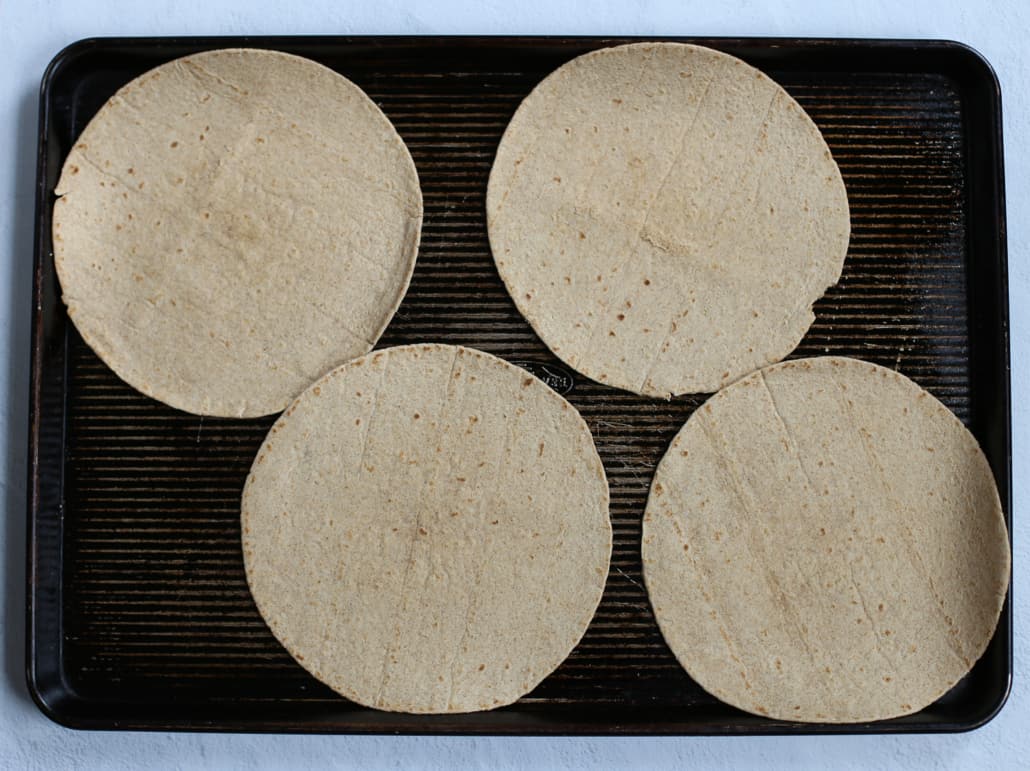 tortillas on a baking sheet