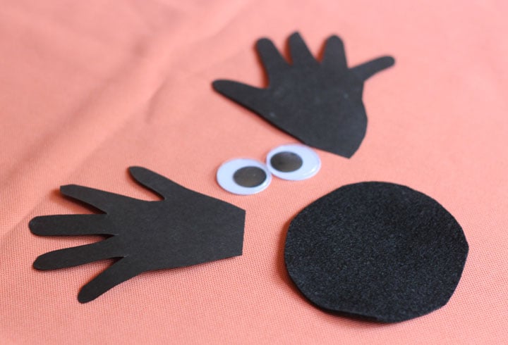 Materials needed for handprint spider craft. 