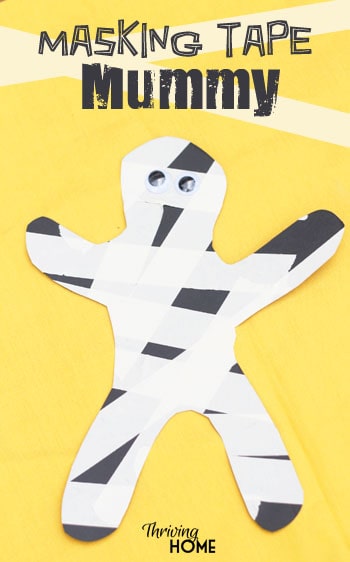 Masking tape mummy halloween craft.