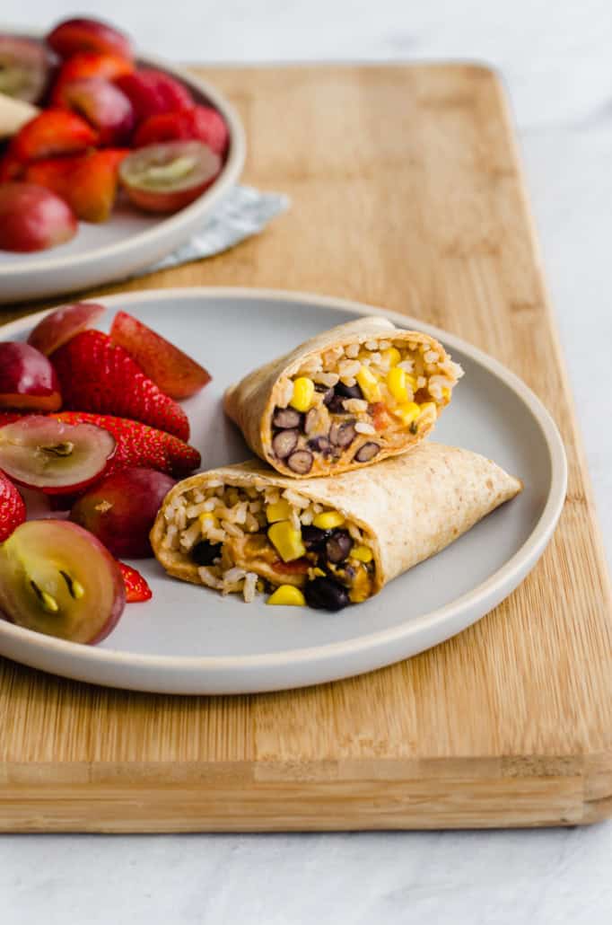 freezer-friendly lunch wraps on a wooden cutting board