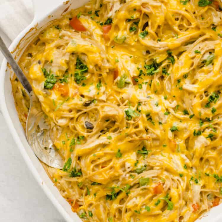 Chicken spaghetti in a white baking dish.