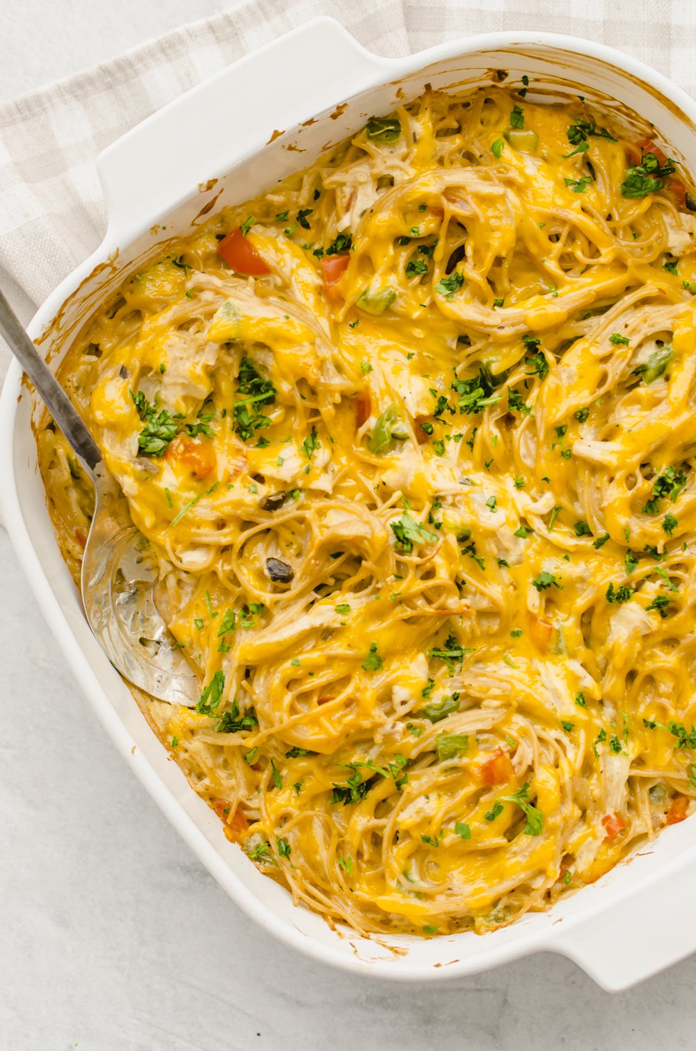 Freezer-friendly chicken spaghetti in a white baking dish ready to be served.