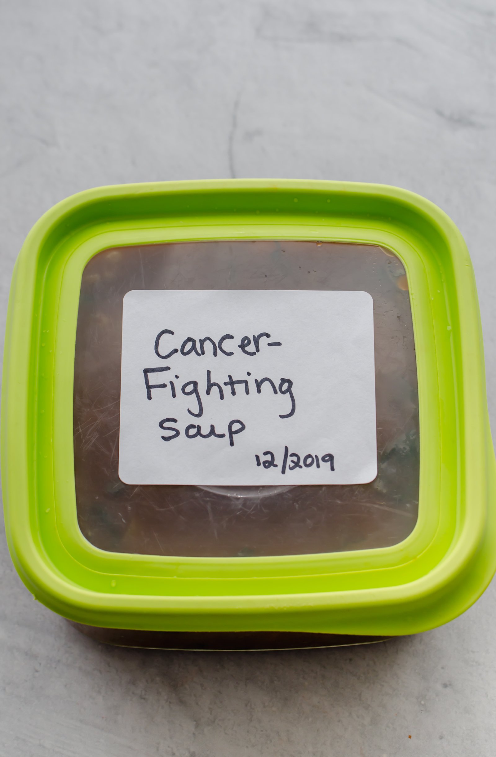Full freezer container labeled Cancer Fighting Soup.