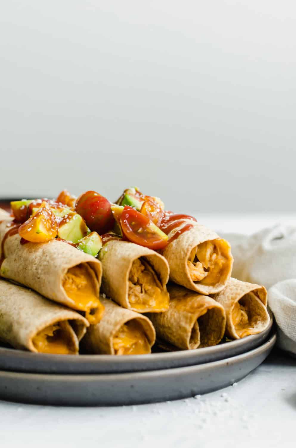 Slow Cooker Chicken and Cheese Taquitos (Easy and freezer-friendly!)