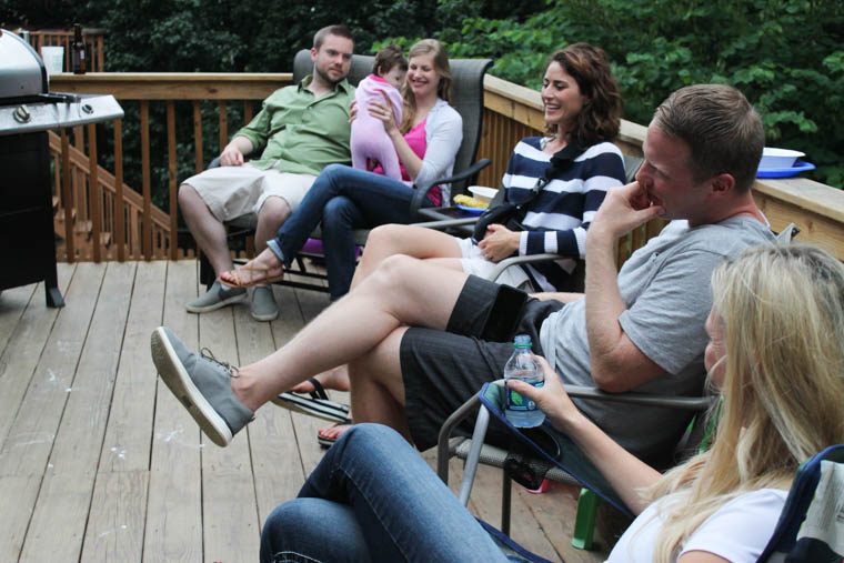 A group of people gathered on a deck.