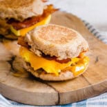 Breakfast sandwiches on a cutting board.