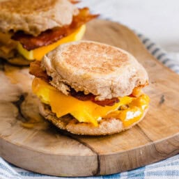 Breakfast sandwiches on a cutting board.