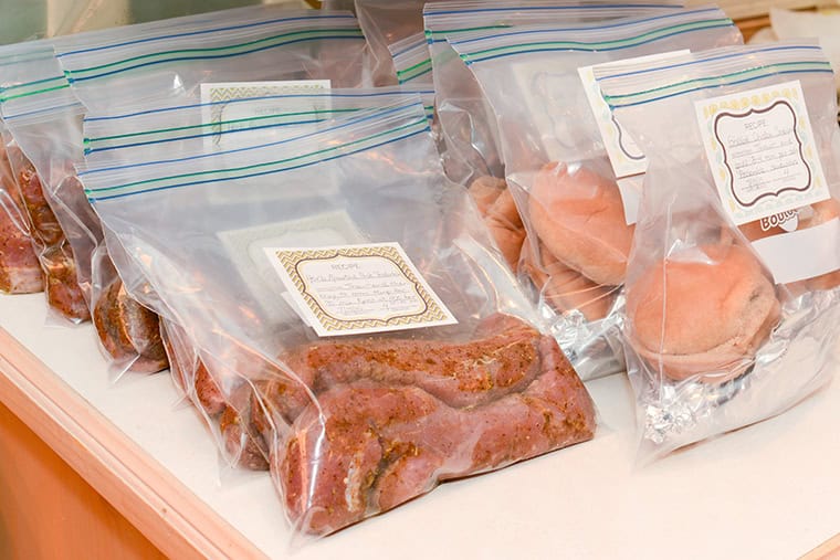 Freezer meals in freezer bags with labels.