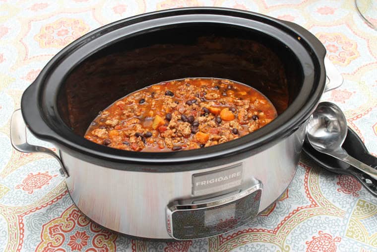 Healthy Turkey Chili with Sweet Potatoes and Black Beans in a slow cooker.