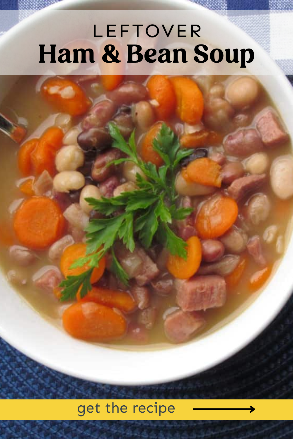 Ham and bean soup on a bowl with fresh parsley in a white bowl.