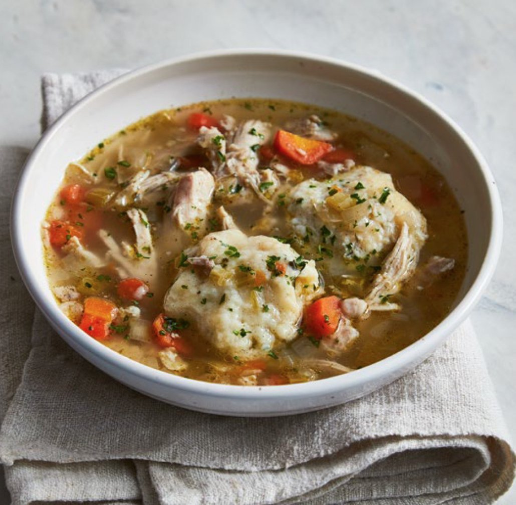 Slow Cooker Chicken and Dumplings in a white bowl