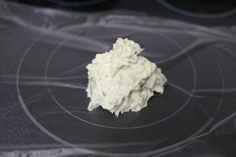 Garlic herb butter after being mixed and ready to be formed.