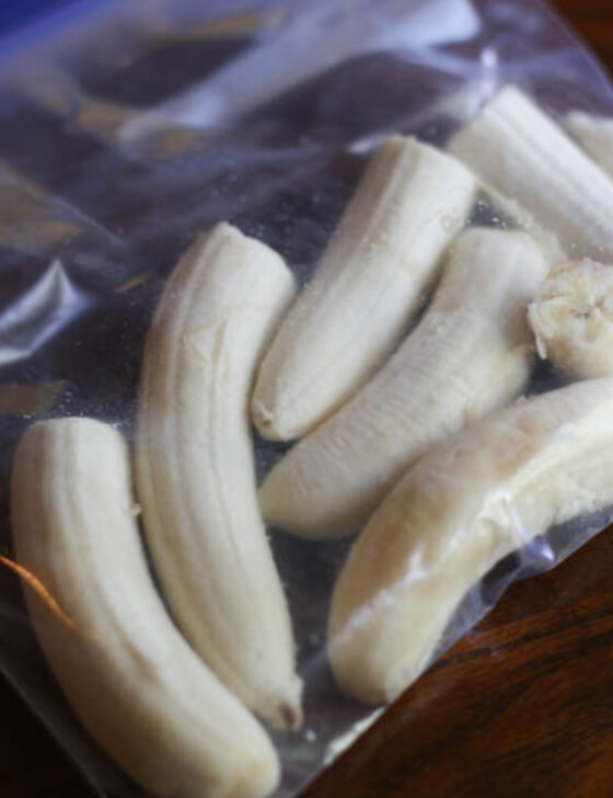 Peeled bananas, chopped in half and placed in a freezer-safe bag to be frozen.
