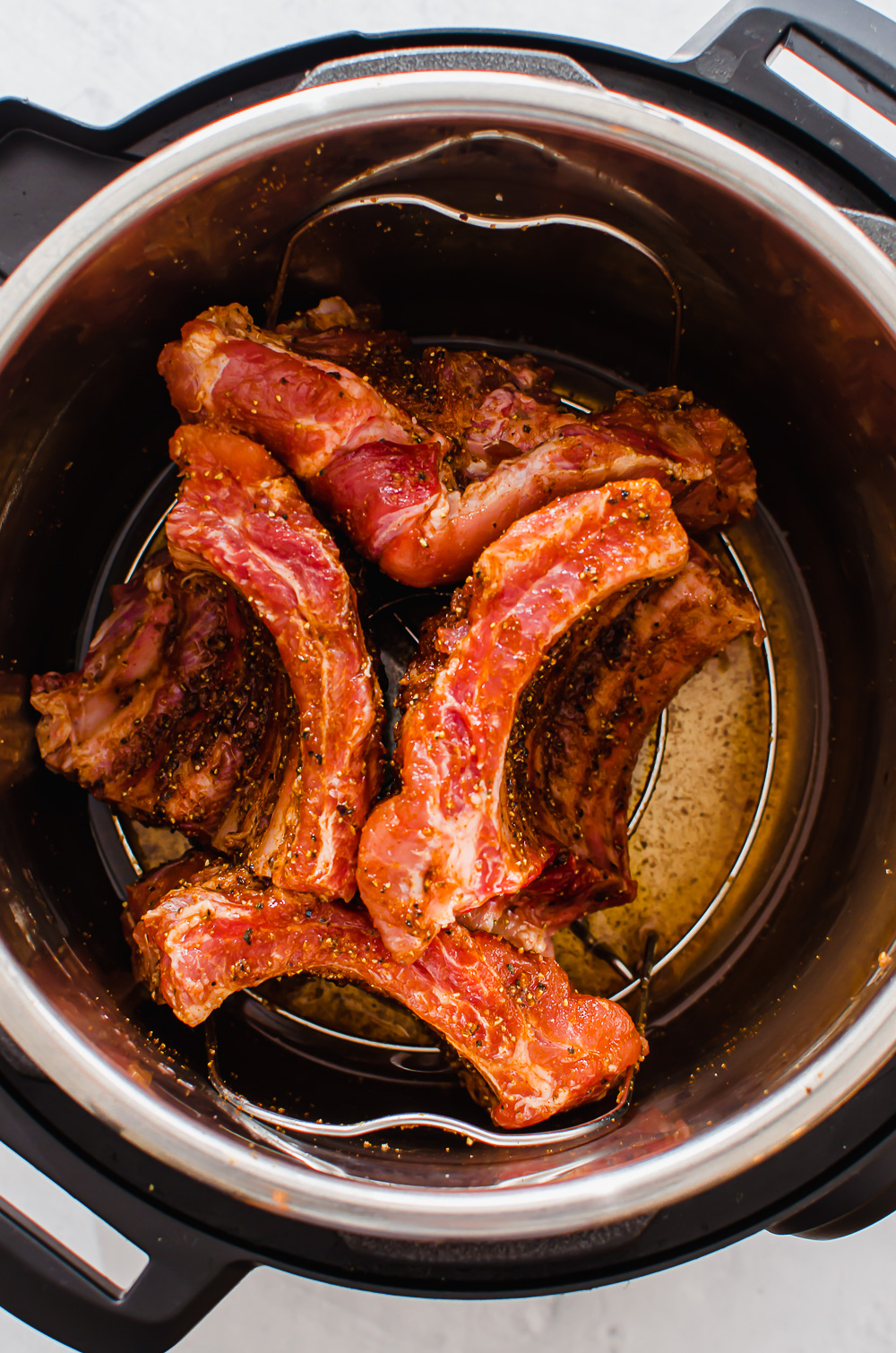 Baby back ribs in the Instant Pot before cooking.