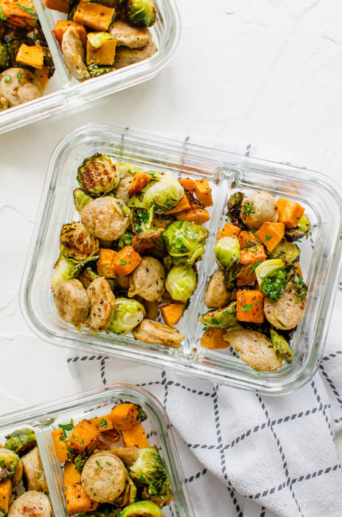 roasted chicken sausage, Brussels sprouts, and sweet potatoes in a glass meal prep dish