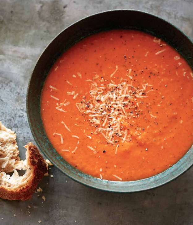 Slow cooker Tomato Soup in a bowl with bread