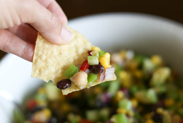 texas caviar dip on a chip--a side dish that goes with all kinds of Mexican recipes