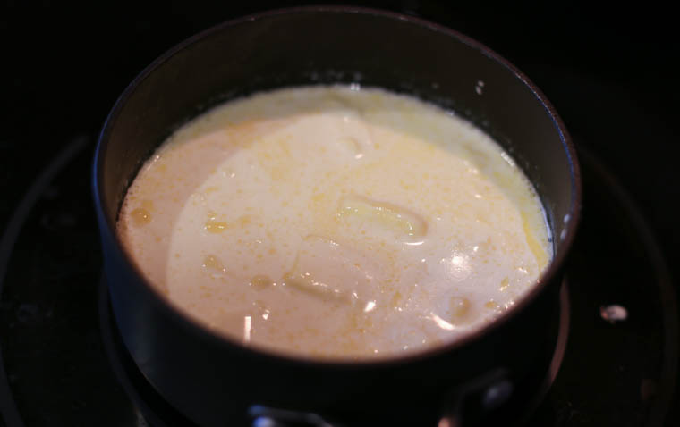 Heavy cream and butter in a sauce pan on the stove. 