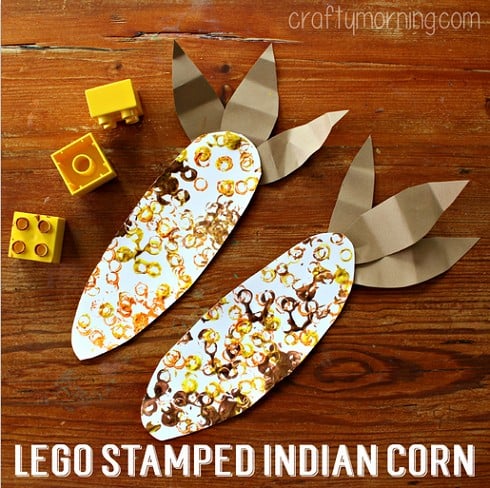 Card stock cut into ovals like the shape of corn with legos used to stamp different color circles as the kernels.